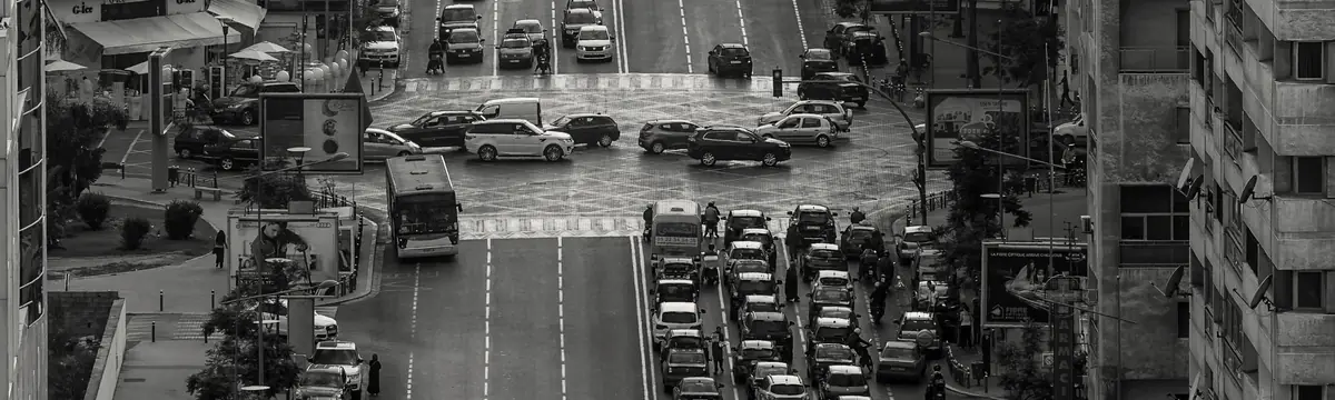 Boulevard d'Anfa seen from a rooftop, black and white: dense traffic between buildings
